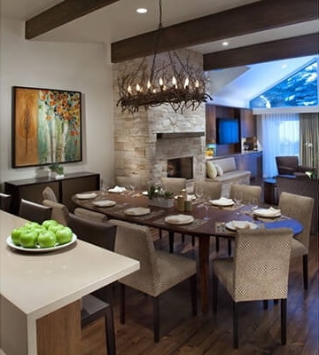 Long twig chandelier over open plan dining area in contemporary home.